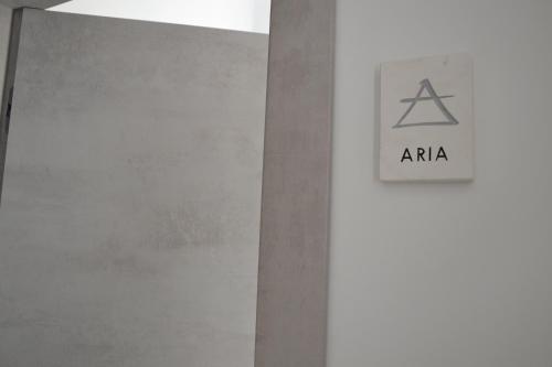 aania sign on the wall of a building at Quintessenza - Charme Rooms in Vieste