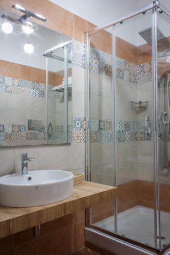 a bathroom with a sink and a shower at Case Vacanze Al Duomo in Licata