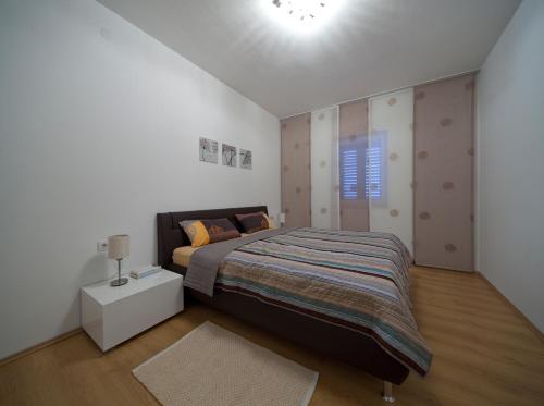 Кровать или кровати в номере Apartments Lovely Croatia