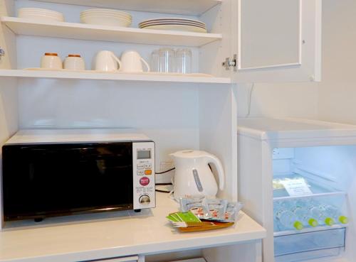 Dapur atau dapur kecil di Condominium Panoramique Motomachi