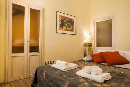 Posteľ alebo postele v izbe v ubytovaní Minzoni Loft