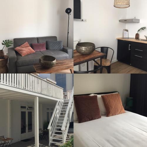 a living room with a couch and a bed at appartementen zeespiegel in Zandvoort