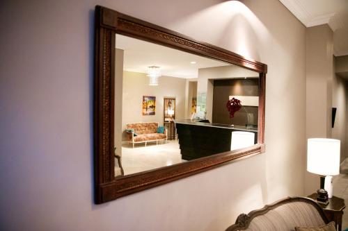
a mirror in the corner of a room at Galeon Mar del Plata Hotel in Mar del Plata
