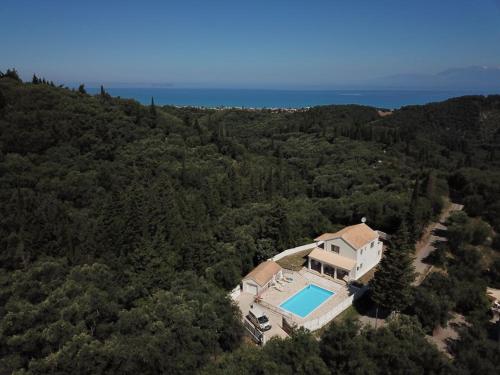 an aerial view of a house with a swimming pool at Villa Fedrita in Acharavi