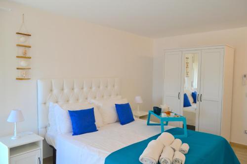 En eller flere senge i et værelse på Rivamare Loft SEASIDE by Picasa Sicilia - Sea & Ortigia view