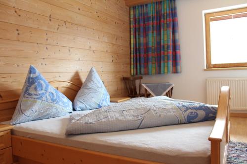 Postel nebo postele na pokoji v ubytování Appartements Moahof Zuhaus