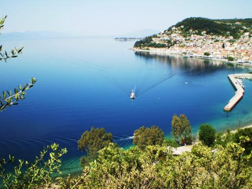 a view of a bay with a boat in the water at Glafki in Limne