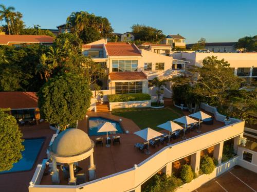 an aerial view of a house with a swimming pool at The View Boutique Hotel & Spa in Amanzimtoti