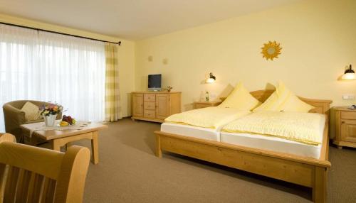 Кровать или кровати в номере Pension Landhaus Hochfeld
