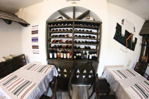 a wine cellar with a rack of wine bottles at Casa Bucovineana in Suceava