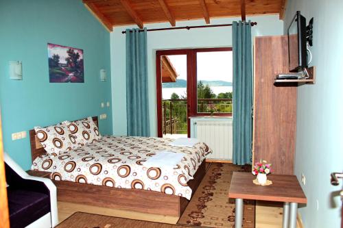 Ένα ή περισσότερα κρεβάτια σε δωμάτιο στο Къщи за гости Илиеви , Цигов Чарк