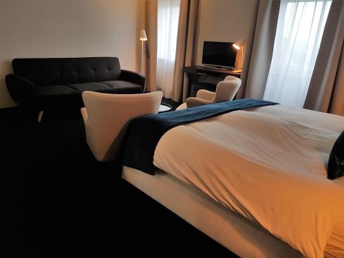 Łóżko lub łóżka w pokoju w obiekcie Hotel Herrloh
