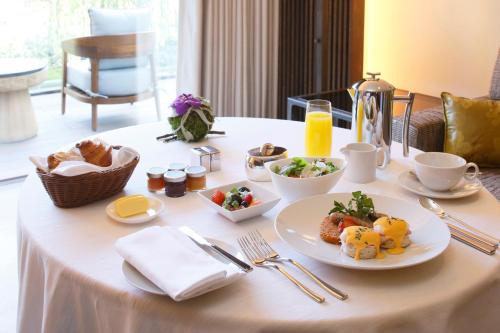 a table with a plate of breakfast food on it at Four Seasons Hotel Kyoto in Kyoto