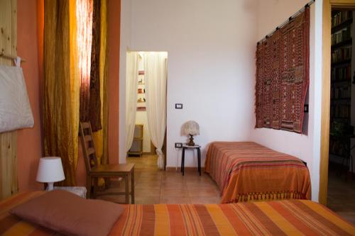 Säng eller sängar i ett rum på Villa Lancellotti