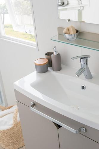 a white bathroom with a sink and a mirror at Lake Park in Berlare