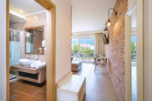 a bathroom with a sink and a mirror at Luxury Villa Fotini in Limenas