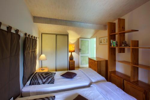Llit o llits en una habitació de Les Abris de Saint Sulpice - Saint-Émilion