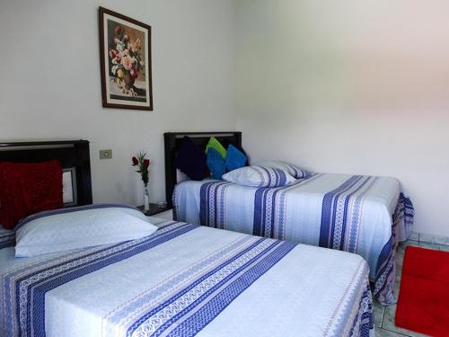 Cama ou camas em um quarto em Pousada Israel