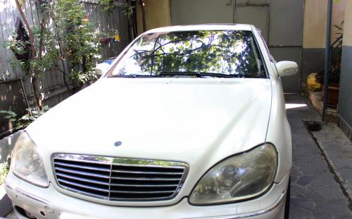 a white car parked on the side of a street at Golden Way in Tbilisi City