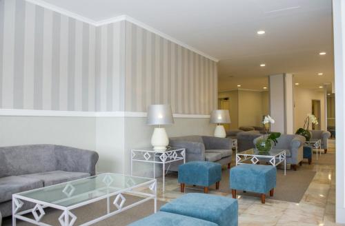a living room with couches and chairs at Florasol Residence Hotel - Dorisol hotels in Funchal