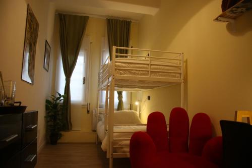 A bed or beds in a room at Mila Guest House