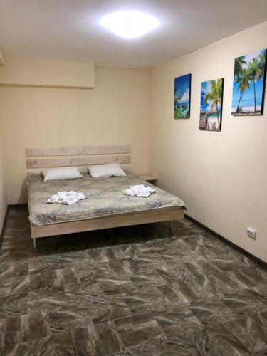 a bedroom with a bed in a room at SV apartments in Zatoka