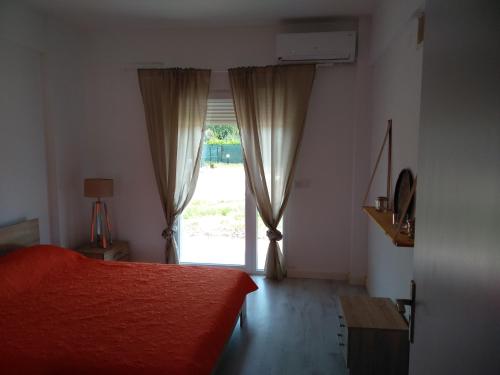 Postel nebo postele na pokoji v ubytování Villa Katia