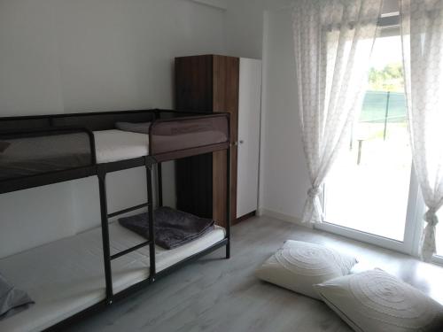 Postel nebo postele na pokoji v ubytování Villa Katia