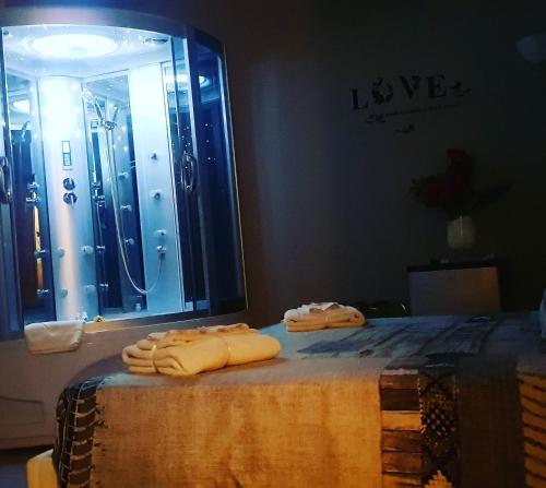 two towels on a table in front of a mirror at La Casa Dei Sogni in Gallico