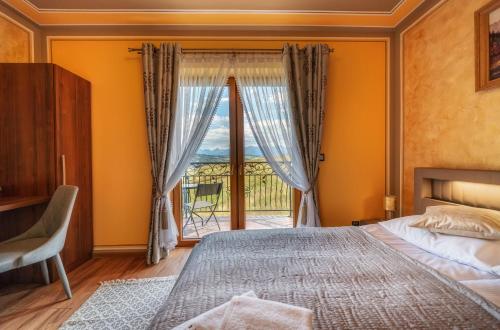 a bedroom with a bed and a large window at u kowola in Szaflary