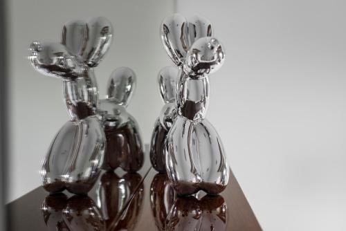 a group of glass vases sitting on a table at The Joseph in Vilnius
