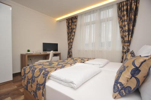 Postel nebo postele na pokoji v ubytování Motel As