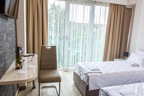 Postel nebo postele na pokoji v ubytování Zam Residence