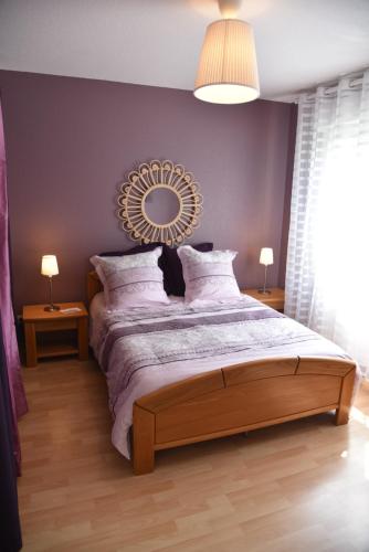 En eller flere senge i et værelse på Le cerisier