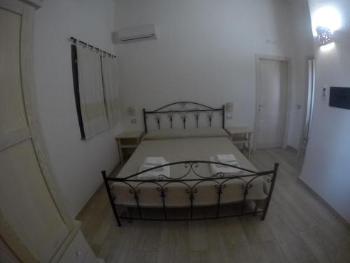 a bedroom with a bed in a room at Agriturismo Su Meurreddu in Tratalias