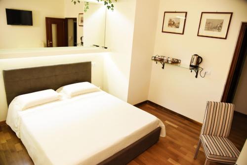 Postel nebo postele na pokoji v ubytování B&B Al Vecchio Glicine