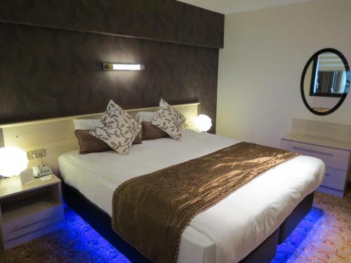 Кровать или кровати в номере Tempo Residence Comfort Izmir