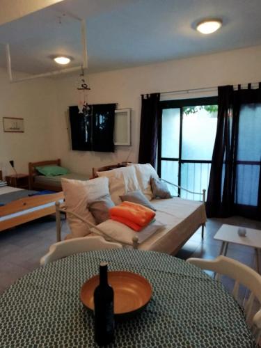 a living room with a couch and a table at Blue Holidays Apartment in Šibenik