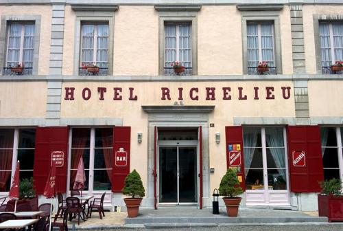 a hotel with a sign on the front of a building at Hotel Richelieu in Eaux-Bonnes