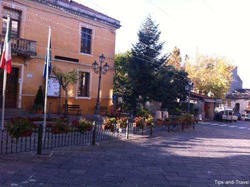 a building with flags on the side of a street at Casa Ferrara in Francavilla in Sinni