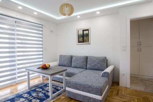 a living room with a couch and a table at Guest House Hendek in Sarajevo