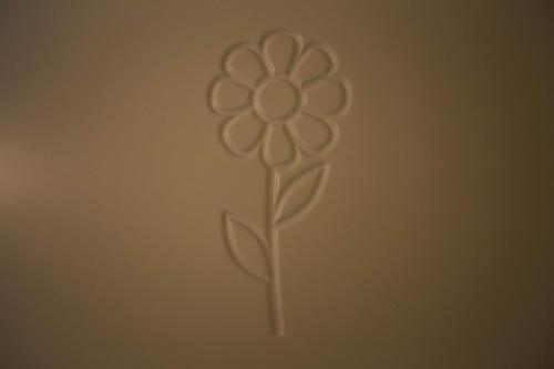 a drawing of a flower on a wall at B&B Da Peppa in Castellammare del Golfo