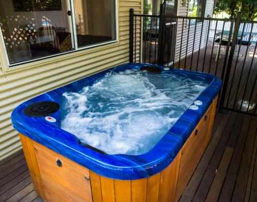 a jacuzzi tub sitting on a porch at Farview Guest Accommodation in Pickering Brook