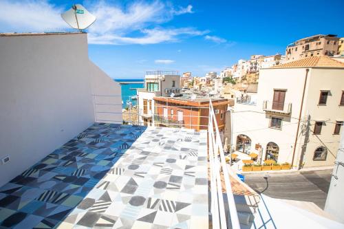 a balcony with a view of a city at B&B Da Peppa in Castellammare del Golfo