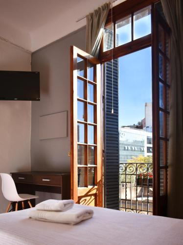 Una cama o camas en una habitación de Gran Rex Hotel