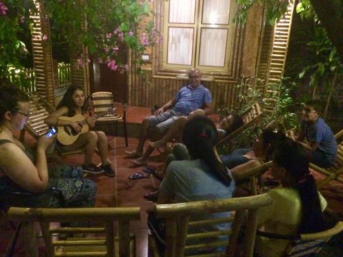 a group of people sitting in chairs in a room at Tam Coc Sunshine Homestay in Ninh Binh