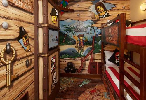 a room with a pirate themed bedroom with a bunk bed at LEGOLAND California Hotel and Castle Hotel in Carlsbad