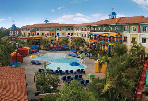 a resort with a swimming pool and a building at LEGOLAND California Hotel and Castle Hotel in Carlsbad