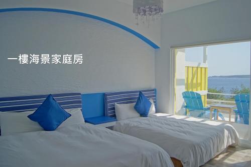 Postel nebo postele na pokoji v ubytování 南灣飯店 Kenting Nanwan Hotel