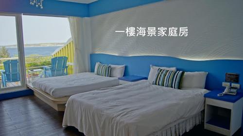 Postel nebo postele na pokoji v ubytování 南灣飯店 Kenting Nanwan Hotel